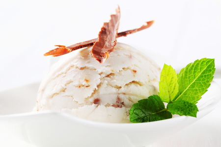 Scoop of stracciatella ice cream topped with chocolate shavingsの写真素材