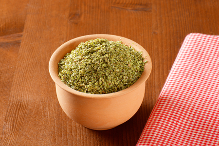 Dried Marjoram leaves in a ceramic potの写真素材
