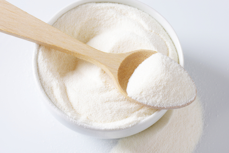 Bowl of full cream powdered milkの写真素材