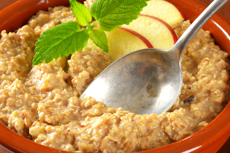 Bowl of white oats porridgeの写真素材