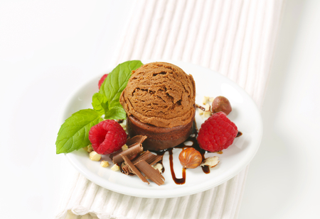 Mini chocolate cake and scoop of ice creamの写真素材