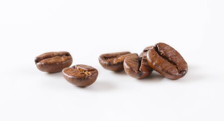 Roasted coffee beans on white backgroundの写真素材