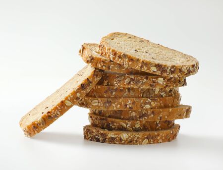 Stack of slices of whole grain breadの写真素材