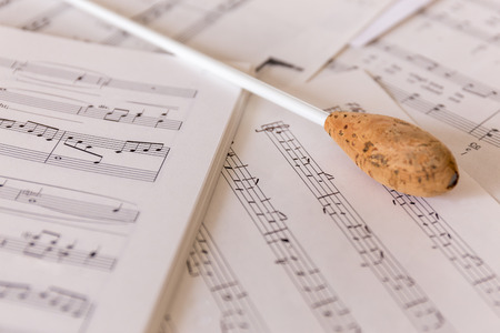 A natural conductors baton on sheet musicの写真素材