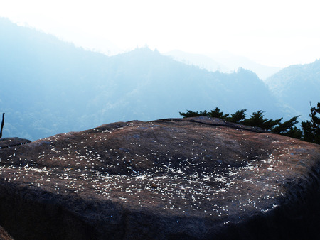 Coinflipping on a stone in Hiroshima, Japanの写真素材