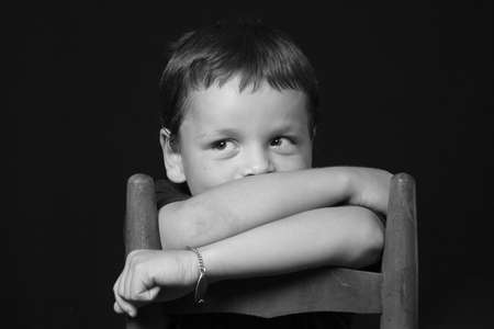 Portrait of a shy young boyの写真素材