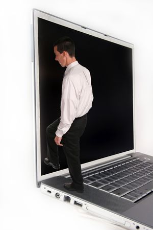 Business Man climbing into Laptop Computerの写真素材