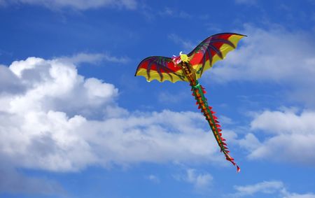 Bright Dragon Kite in a Beautiful Sky With Slight Motion Blurの写真素材