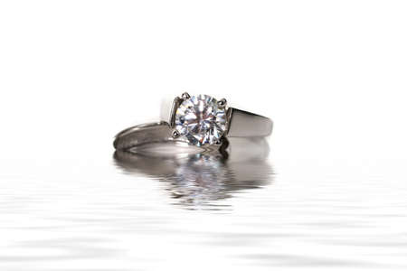 Platinum White Gold Diamond Wedding Engagement Ring With Band Isolated on White Background With Water Effectの写真素材