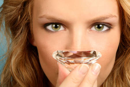 Woman Holding Diamond With High Depth of Fieldの写真素材