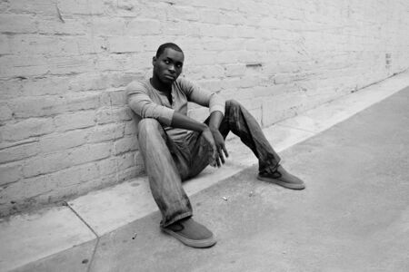 Unhappy Street Kid in an Alleyの写真素材