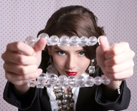 Pretty Woman Looking Through a Lucite Necklaceの写真素材