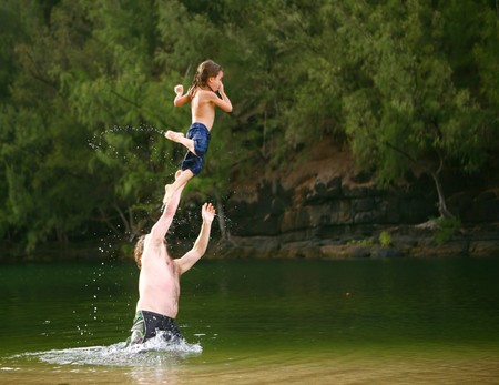 Playful Father Playing in the Water With His Sonの写真素材