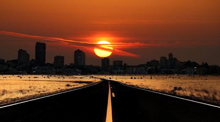 Low Sunrise Above a City From the View of the Countrysideの写真素材