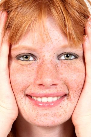 Beautiful Freckled Model Closeup With Hands Framing Her Faceの写真素材
