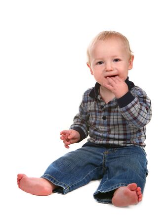 Happy Boy Toddler With Hand in His Mouth on WHite Backgroundの写真素材