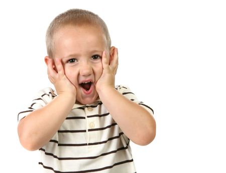 Shocked and Surprised Young Child on White Backgroundの写真素材