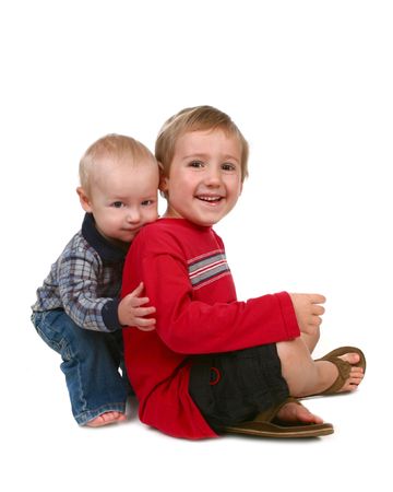 Sweet Young Brothers Happy and Smiling on White Backgroundの写真素材