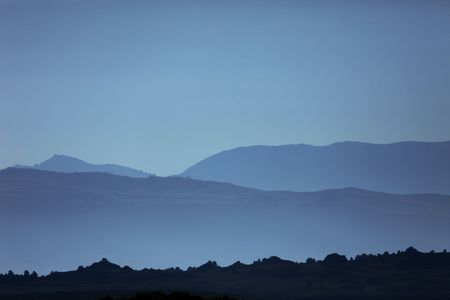 Soft and Beautiful Ghostly Mountain Silhouettesの写真素材