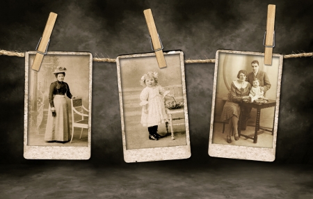 Three Authentic Vintage Family Photographs Hanging on a Rope By Clothespinsの写真素材