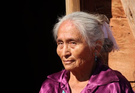 Navajo Elderly Woman Outdoors in Bright Sunの写真素材