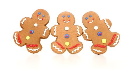 Three Happy Smiling Gingerbread Figures on White Background