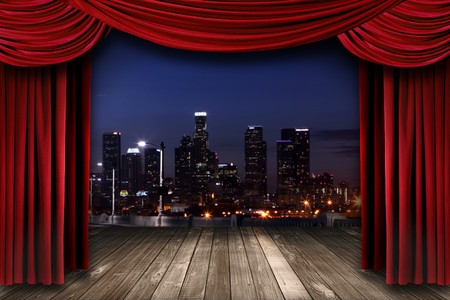 Dramatic Theater Stage Curtain Drapes With a Night City as a Backdrop