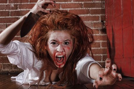 Woman in Horror Situation With Bloody Faceの写真素材