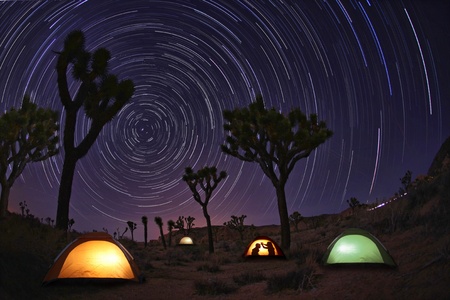 Illuminous Light Painted Landscape of Camping and Starsの写真素材