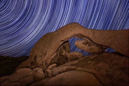 Star Trail Streaks over the Rocks of Joshua Tree Parkの写真素材