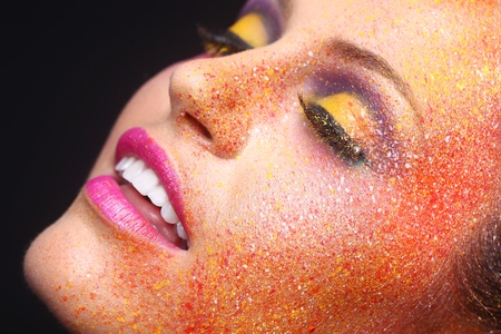 Beautiful Woman With Extreme Spattered Make Up on the Faceの写真素材