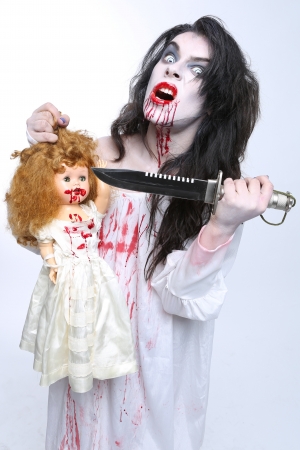Scary Horror Image of a Bleeding Psychotic Woman With Knifeの写真素材