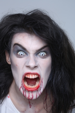 Bleeding Psychotic Woman in a Horror Themed Imageの写真素材