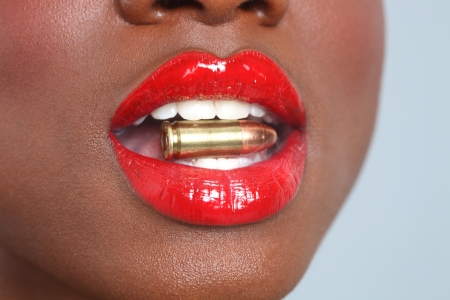 Beautiful Lips of a Woman With A Bullet and Smokeの写真素材