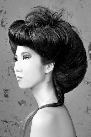 Tall Asian Woman With High Styled Hairの写真素材