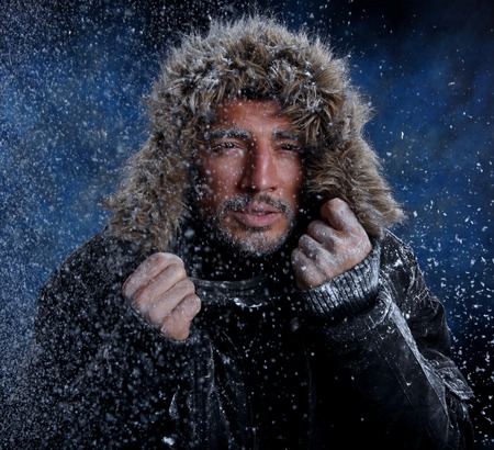 Dramatic Image of Scruffy Man Freezing in Cold Weatherの写真素材