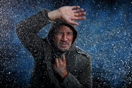 Dramatic Image of Scruffy Man Freezing in Cold Weatherの写真素材