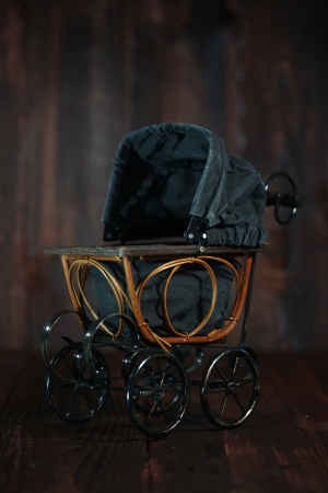 Antique Infant Baby Cradle on Grunge Wooden の写真素材