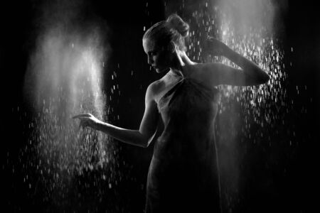 Beautiful Woman With Stop Motion of Explosive Powder Captured by Flash