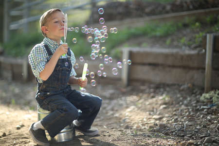 Young Kids Playing on the Farm Outdoors