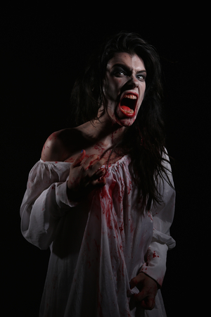 Bleeding Psychotic Woman in a Horror Themed Imageの写真素材