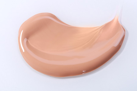 Liquid Beige Make Up Foundation on White Background Smearedの写真素材