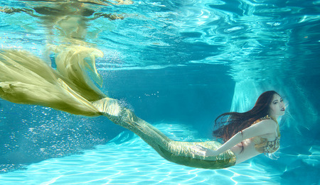 Woman Swimming Like a Mermaid Underwater Outdoorsの写真素材