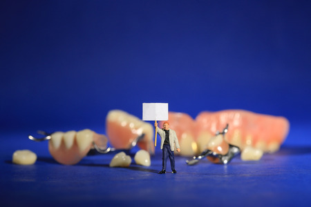 Hilarious Miniature Workers Performing Dental Procedures. Dental Office Art.の写真素材