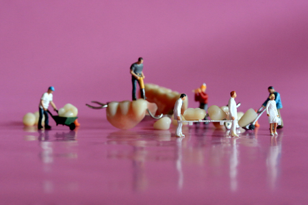 Hilarious Miniature Workers Performing Dental Procedures. Dental Office Art.の写真素材