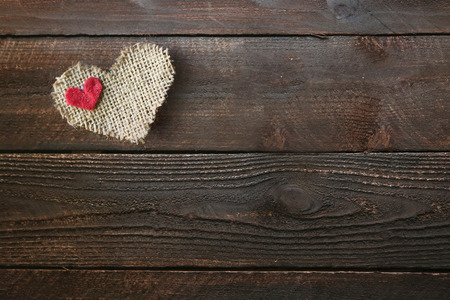Burlap Heart on a Wooden Background With Copy Spaceの写真素材