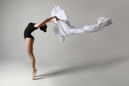 Beautiful Ballet Dancer in Studio on White Backgroundの写真素材