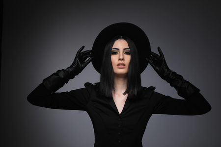High Fashion Model Wearing Black Hat and Leather Glovesの写真素材