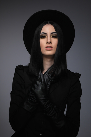 High Fashion Model Wearing Black Hat and Leather Glovesの写真素材