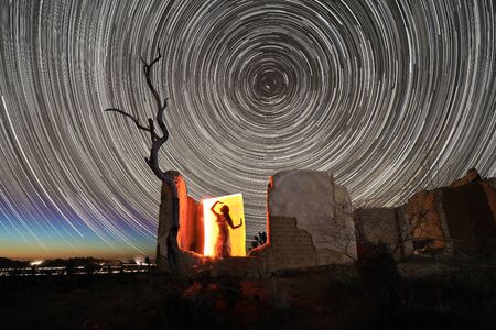 Girl Light Painted in the Desert Under the Night Skyの写真素材